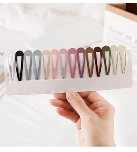Detailed set of 15 colorful candy-colored metal teardrop hair clips on a white display card