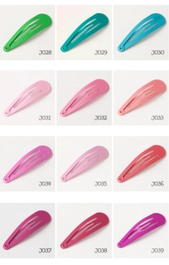 Close-up of 12 assorted candy color teardrop metal snap hair clips in matte finish
