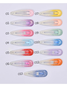 Detailed view of 13 colorful gradient snap hair clips with sparkling glitter finish