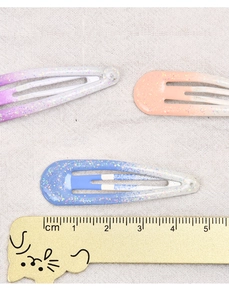 5cm gradient color hair clips with glitter finish shown on a measurement ruler