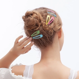 Colorful candy-colored snap hair clips in multiple vibrant shades on a clean white backdrop