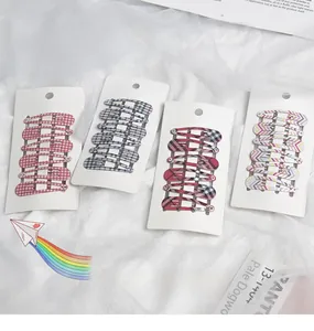 Detail view of 24-piece girls' plaid hair clip set with classic patterns and BB clips