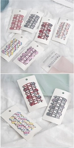 Close-up of cute plaid pattern BB hair clips set for girls on a white display card