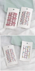 Detail of colorful plaid and geometric pattern BB hair clips set for girls and kids