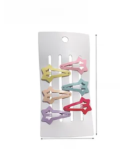 Vue détaillée de 6 barrettes étoiles aux couleurs macaron sur carte de présentation