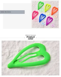 Close-up of heart-shaped hair clips with matte rubber paint finish in neon colors