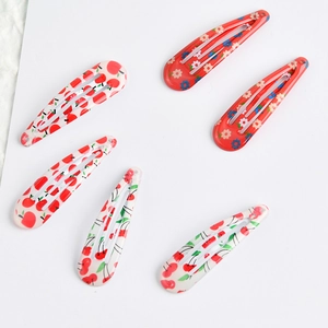 6pcs set of floral and cherry print snap hair clips for girls in a radial layout