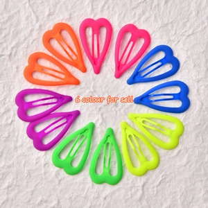 Set of 12 fluorescent heart-shaped drop hair clips in six vibrant neon colors