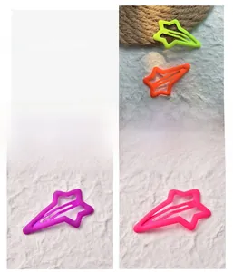 Star-shaped matte neon metal hair clips in yellow, orange, purple and rose pink