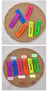 Detailed macro view of 7cm matte neon candy colored rectangle hair clips in six vibrant shades