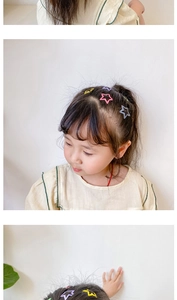 Detail of colorful matte star hair clips for children in various pastel candy colors