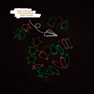 Glow-in-the-dark Korean candy colored snap hair clips in star and teardrop shapes