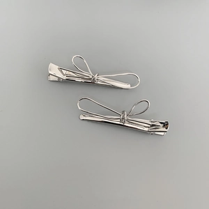 Minimalist silver metal bow hair clips with elegant alloy plating for women