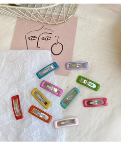 Detailed close-up of colorful rectangular 10-piece metal hair clip set for girls