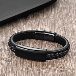 Close-up of black braided leather bracelet with polished metal magnetic clasp for men