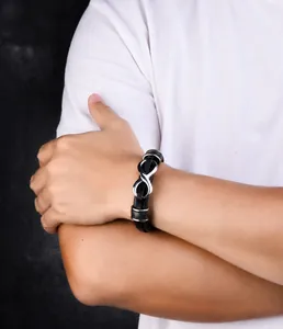 Close-up of a men's infinity symbol leather bracelet with a magnetic stainless steel clasp