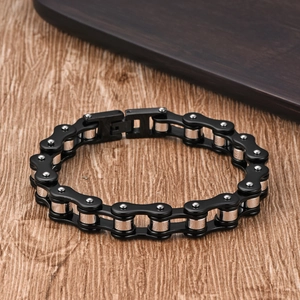 Detail of a biker chain bracelet featuring matte black finish and polished steel links