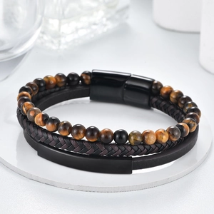 Men's multilayer bracelet featuring tiger eye beads and braided leather with magnetic clasp