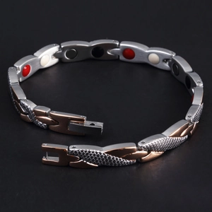 Detail view of magnetic therapy steel bracelet with snake texture and rose gold plating