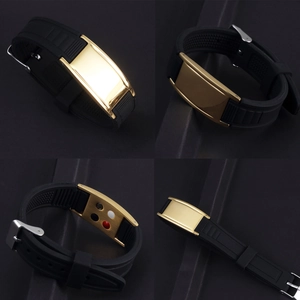 Detail of adjustable black silicone wristband with gold stainless steel and energy stones