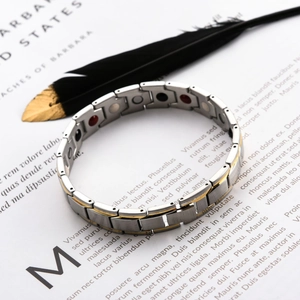 Two-tone magnetic stainless steel therapy bracelet with brushed gold and silver finish