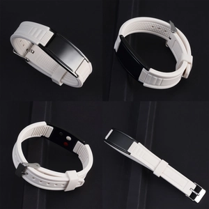 Detail view of adjustable white silicone wristband with black sensor and silver buckle