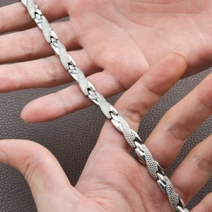 Men's stainless steel magnetic bracelet with unique snake pattern scales and gold accents