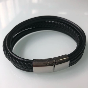 Men's multilayered black leather bracelet with a polished silver magnetic clasp closure