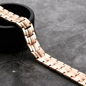 Detail of rose gold stainless steel link bracelet with brushed and polished finish