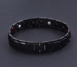 Close-up of 12mm black magnetic therapy bracelet with inset energy stones in stainless steel