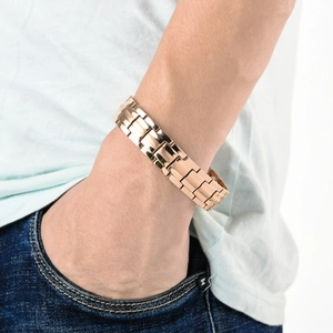 Close-up of rose gold double row magnetic therapy bracelet on a man's wrist