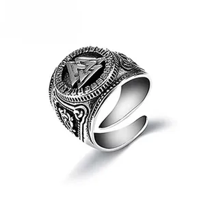 Macro detail of vintage silver Viking Valknut ring with adjustable open band for men