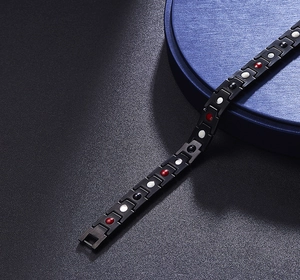 Detail of 12mm matte black magnetic therapy bracelet with inset health stones