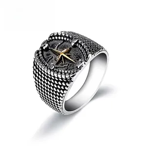 Men's vintage stainless steel compass ring with golden star and black textured finish