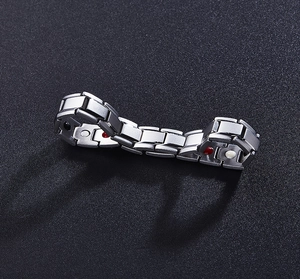 Detail view of 12mm magnetic health bracelet with embedded energy stones on metal links