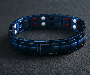 Detail view of men's blue magnetic therapy bracelet showing inner functional stones and link structure