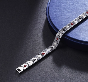 Detailed close-up of 12mm stainless steel magnetic therapy bracelet with colored inserts
