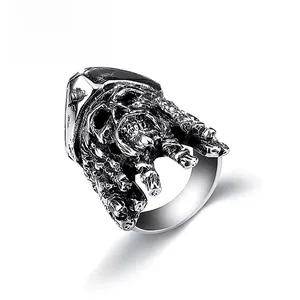 Detailed shot of vintage silver Viking skull ring with gothic bone hand carvings