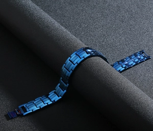 Detail of deep blue stainless steel magnetic bracelet with a matte brushed finish