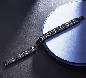 Detail of black stainless steel bracelet showing inner magnets and high polish finish