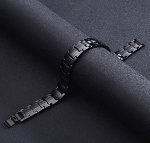 Close-up of black stainless steel chain bracelet with matte and glossy rectangular links