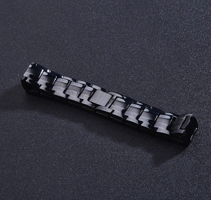 Macro shot of polished black stainless steel link bracelet with double row magnets