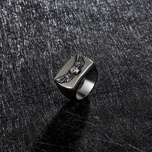 Gothic style stainless steel ring for men with skull and detailed wings in silver-grey finish