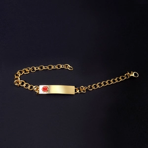 Gold stainless steel medical alert identification bracelet with red Star of Life symbol