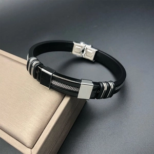 Close-up of silicone men's bracelet featuring a stainless steel woven mesh inlay design