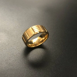 Gold plated stainless steel ring for men with unique geometric stepped textured pattern