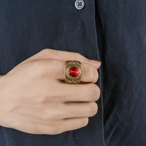 Vintage gold stainless steel men's military ring with a large oval red rhinestone