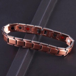 Close-up of brushed copper magnetic health bracelet with embedded therapy stones
