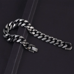 Detail view of heavy cuban link chain bracelet in matte vintage stainless steel finish