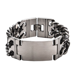 Close-up of matte vintage titanium steel bracelet with brushed texture and ID bar